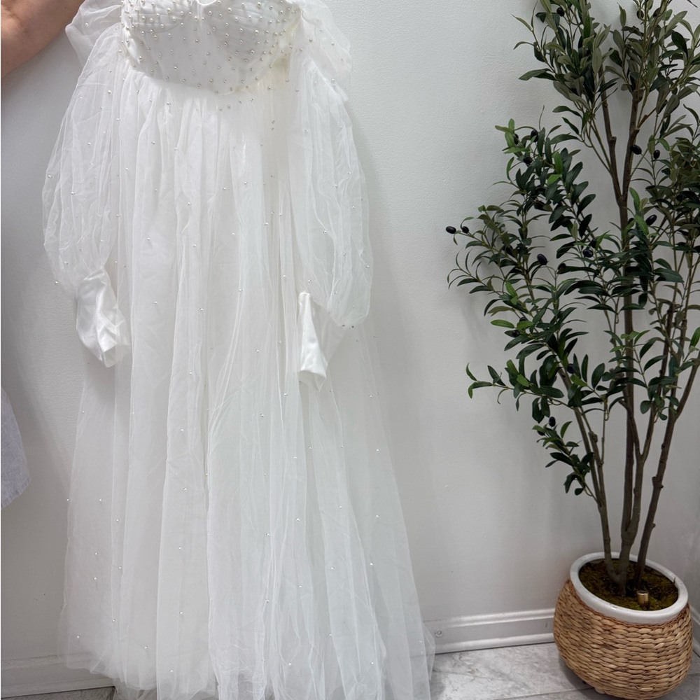 Elegant White Gown with Pearl Details